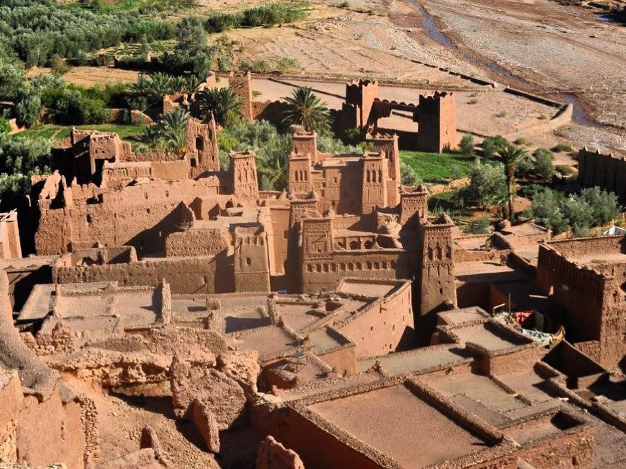 The tiered earthen ksar of Aït Ben Haddou seen from across the Ounila riverbed